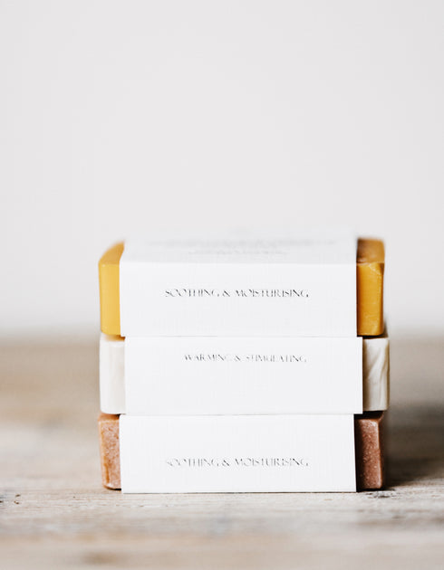 Several stack of bar soap on white surface